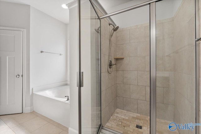 107 Duchess Dr, Madison, AL 35758 - full bathroom with a bath, a stall shower, and tile patterned flooring