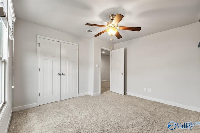 107 Duchess Dr, Madison, AL 35758 - unfurnished bedroom with carpet floors, a closet, and a ceiling fan