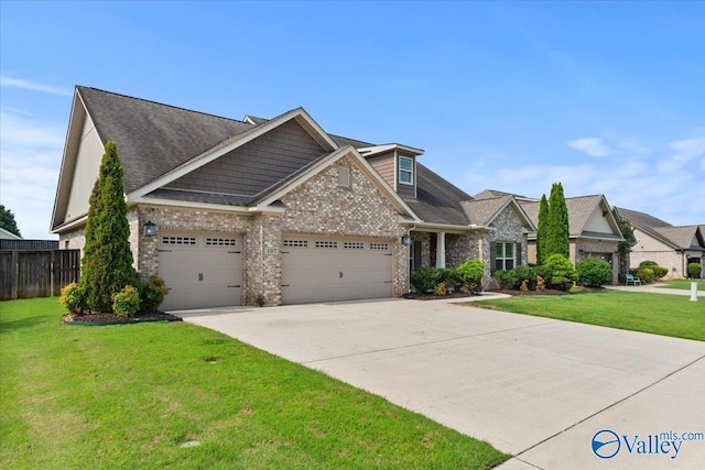 107 Duchess Dr, Madison, AL 35758 - craftsman inspired home featuring a garage, driveway, brick siding, and roof with shingles