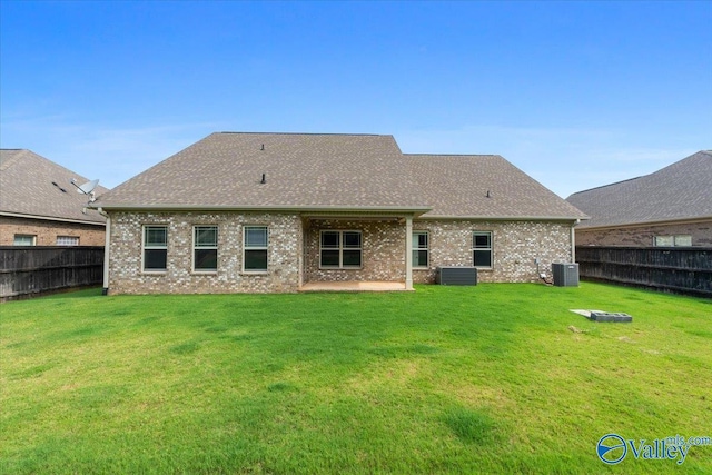 107 Duchess Dr, Madison, AL 35758 - rear view of property with a fenced backyard, brick siding, roof with shingles, and a patio
