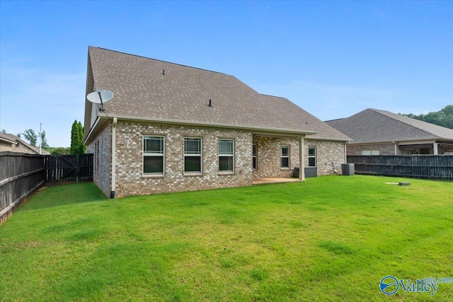 107 Duchess Dr, Madison, AL 35758 - rear view of house with a fenced backyard, a shingled roof, and brick siding