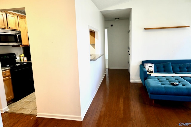 hall with hardwood / wood-style floors