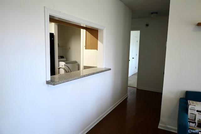 hall featuring washer and clothes dryer and hardwood / wood-style floors