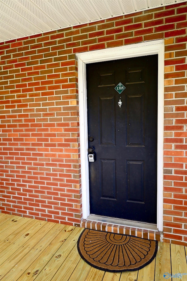 doorway to property featuring a deck