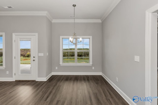 unfurnished dining area with a wealth of natural light, ornamental molding, a notable chandelier, and dark hardwood / wood-style flooring