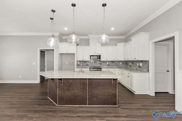 kitchen featuring white cabinetry, a sink, stainless steel appliances, and backsplash