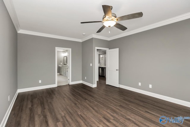 unfurnished bedroom featuring dark hardwood / wood-style flooring, ceiling fan, connected bathroom, and crown molding