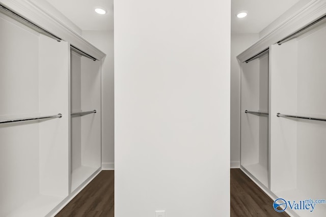 bathroom with baseboards, wood finished floors, and recessed lighting