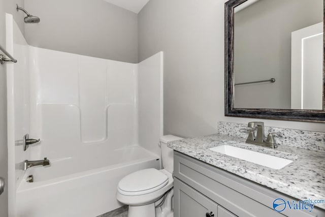 full bath with toilet, vanity, and shower / washtub combination