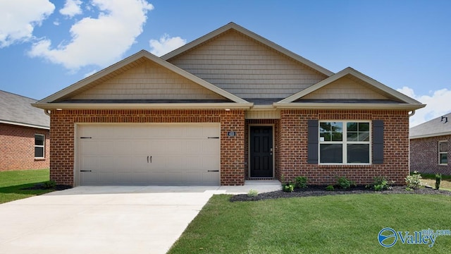 view of front of house with a garage and a front lawn