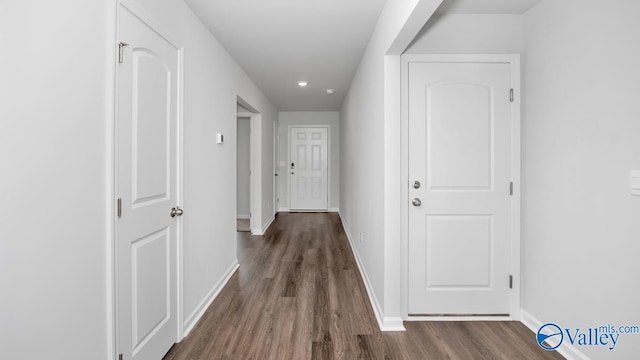 hall featuring dark wood-type flooring