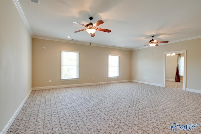 empty room with light colored carpet, crown molding, and a ceiling fan