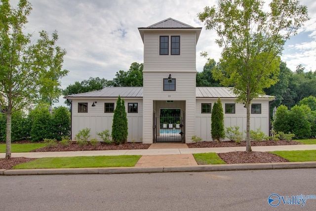 view of front facade featuring board and batten siding and metal roof