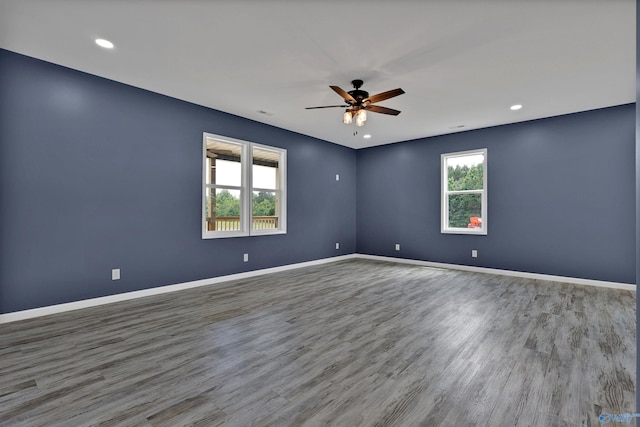 unfurnished room featuring hardwood / wood-style flooring and ceiling fan