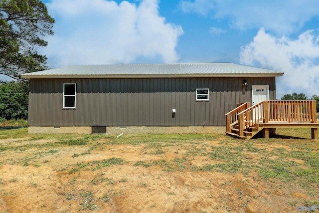 back of property with a wooden deck