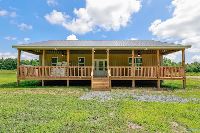 view of front of home with a deck and a front yard