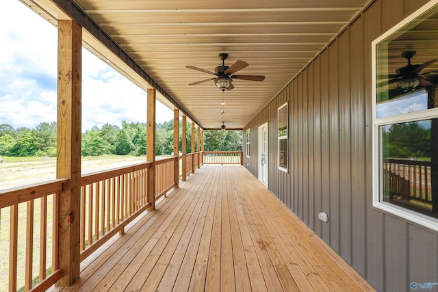 wooden deck featuring ceiling fan