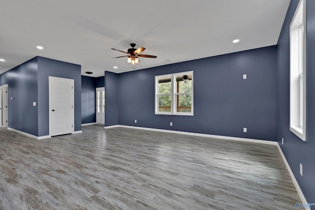 empty room featuring ceiling fan and wood-type flooring