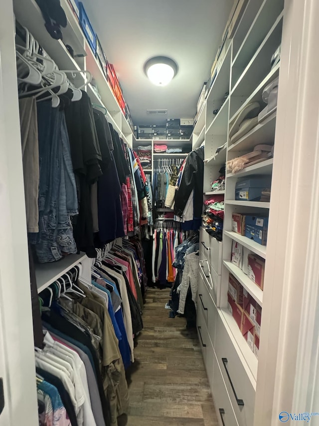 walk in closet featuring hardwood / wood-style floors