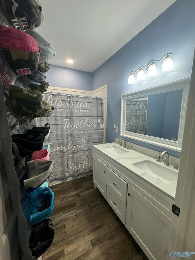 bathroom featuring hardwood / wood-style flooring and vanity