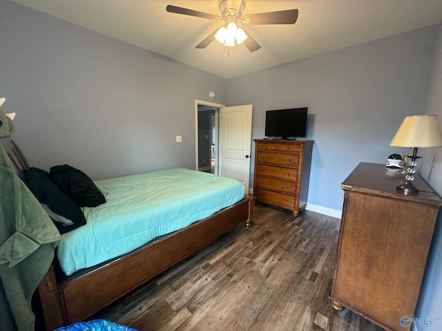 bedroom with ceiling fan and dark hardwood / wood-style flooring