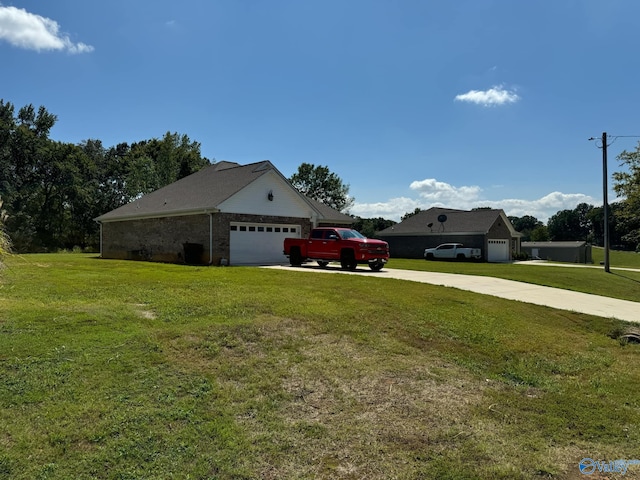 exterior space with a garage and a front lawn