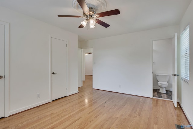 1126 Oster Dr, Huntsville, AL 35816 - unfurnished bedroom featuring ensuite bathroom, ceiling fan, light wood finished floors, and baseboards