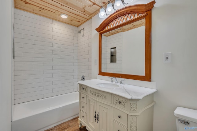 full bathroom featuring vanity, toilet, wooden ceiling, tiled shower / bath combo, and hardwood / wood-style flooring