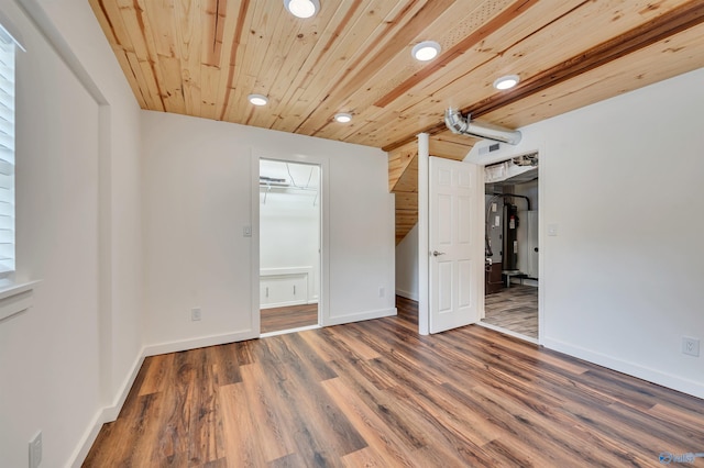 1126 Oster Dr, Huntsville, AL 35816 - unfurnished bedroom with recessed lighting, wooden ceiling, baseboards, and dark wood-style flooring