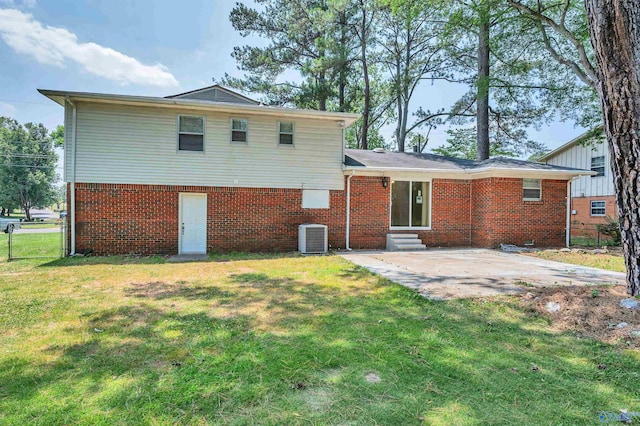 1126 Oster Dr, Huntsville, AL 35816 - back of property with entry steps, a patio, cooling unit, a yard, and brick siding