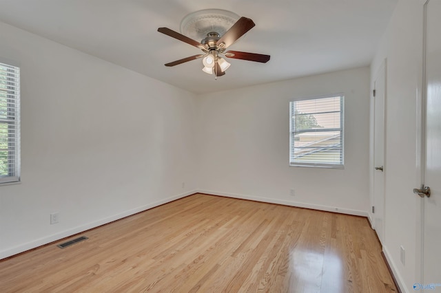 unfurnished room featuring light hardwood / wood-style floors and ceiling fan