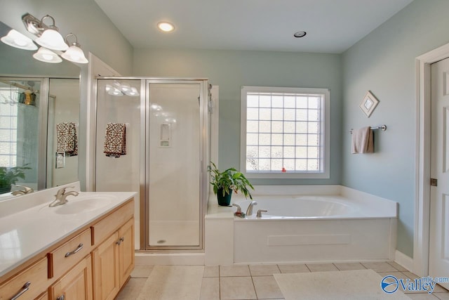 full bathroom with tile patterned flooring, a shower stall, a bath, and vanity