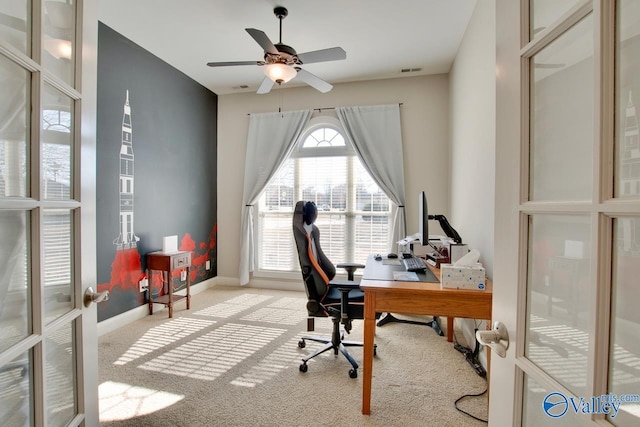 carpeted office featuring visible vents, french doors, a ceiling fan, and baseboards