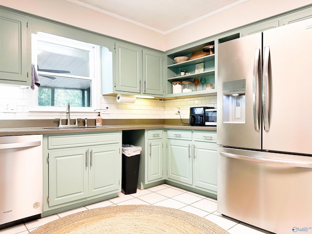 kitchen with a sink, stainless steel fridge with ice dispenser, dishwasher, light tile patterned floors, and decorative backsplash