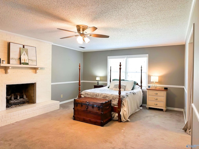 bedroom featuring crown molding, carpet, baseboards, a brick fireplace, and ceiling fan
