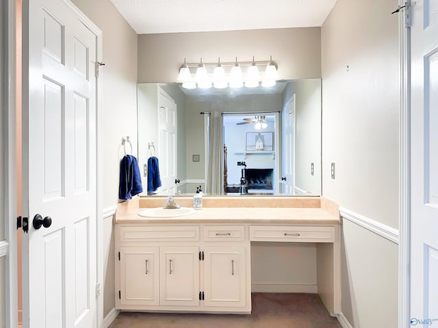 bathroom featuring ceiling fan and vanity