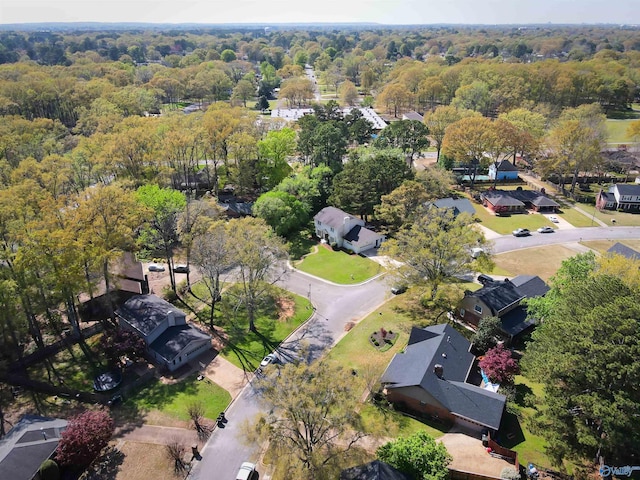 birds eye view of property with a wooded view and a residential view