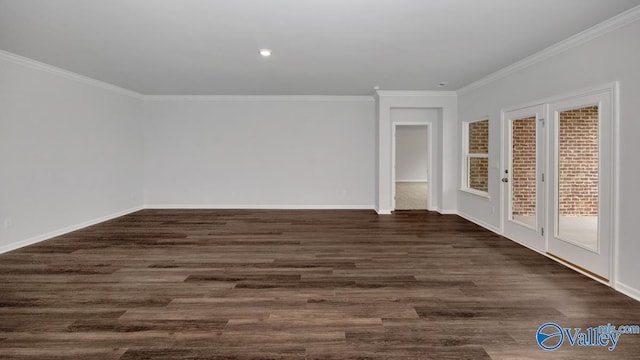 unfurnished room with crown molding and dark wood-type flooring