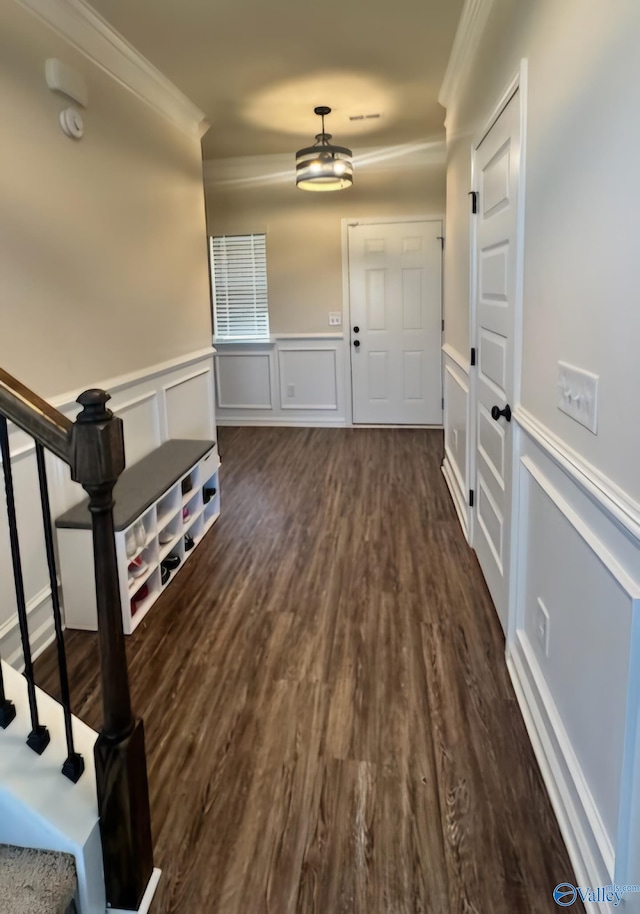 interior space featuring dark hardwood / wood-style floors and ornamental molding