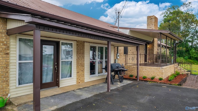 view of side of home with a patio