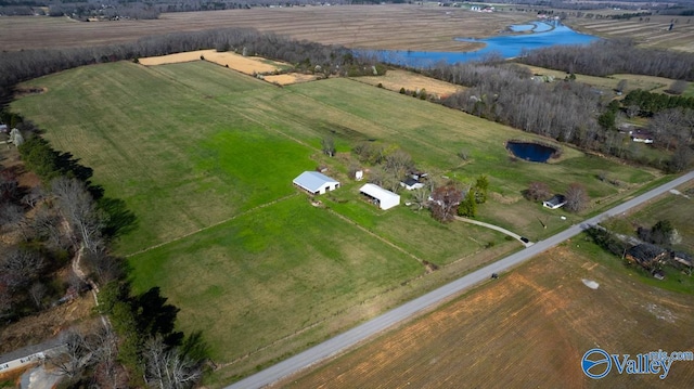 birds eye view of property featuring a rural view and a water view