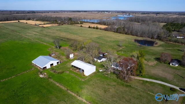 drone / aerial view with a water view and a rural view