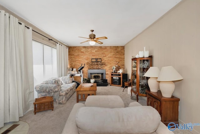 7228 Old Railroad Bed Rd, Toney, AL 35773 - carpeted living room with ceiling fan and a wood stove