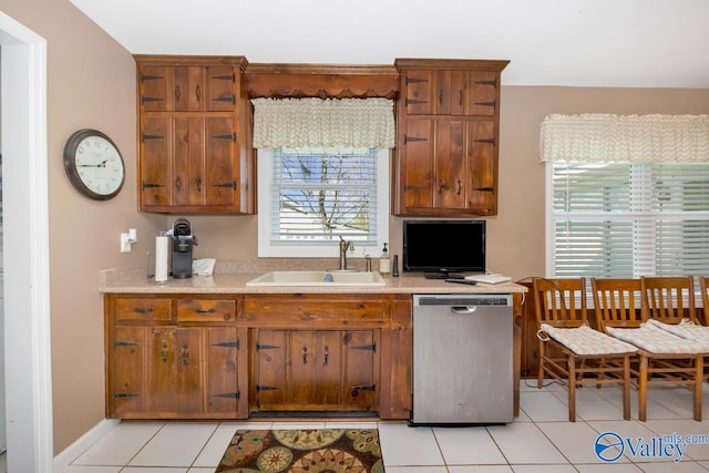 7228 Old Railroad Bed Rd, Toney, AL 35773 - kitchen featuring dishwasher, light countertops, brown cabinets, and a sink
