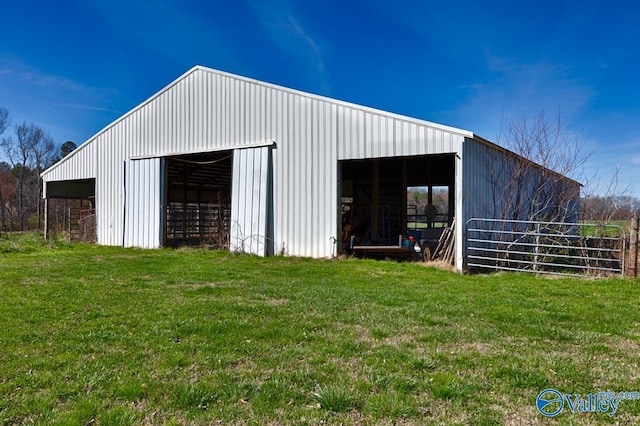 view of outbuilding featuring a yard