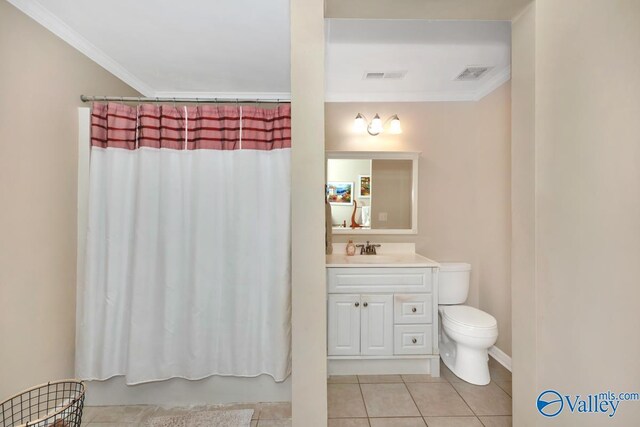 bathroom featuring vanity, tile patterned flooring, toilet, and crown molding