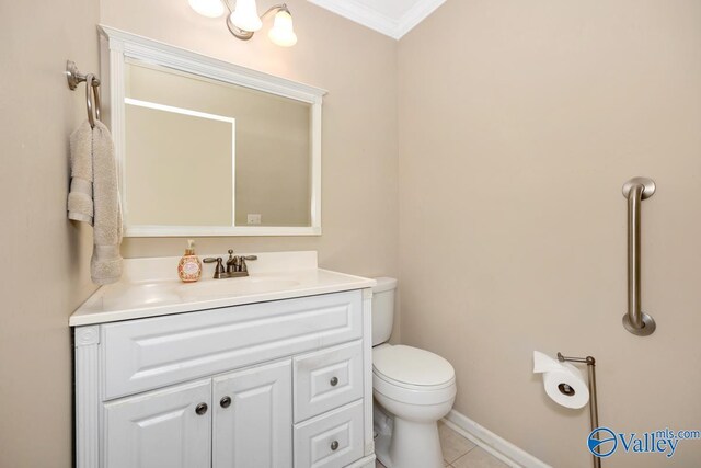 bathroom featuring ornamental molding, vanity, tile patterned floors, and toilet