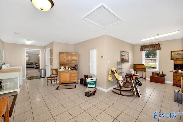 7228 Old Railroad Bed Rd, Toney, AL 35773 - living room with light tile patterned floors, visible vents, baseboards, and attic access