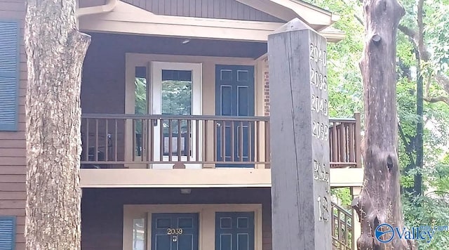 2043 Woodlawn Dr SW Unit 2043, Huntsville, AL 35802 - entrance to property with a balcony and stucco siding