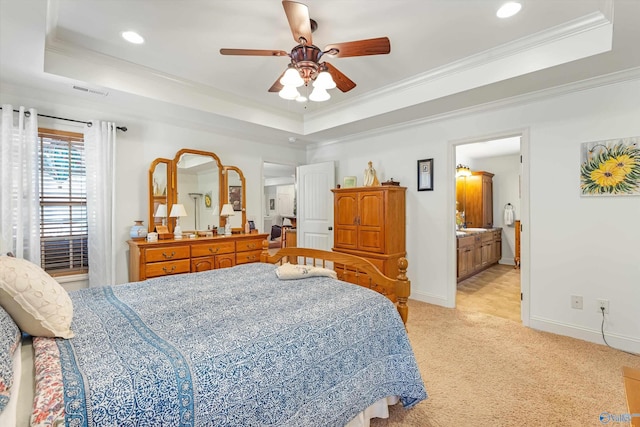 bedroom with light carpet, baseboards, a tray ceiling, and ornamental molding